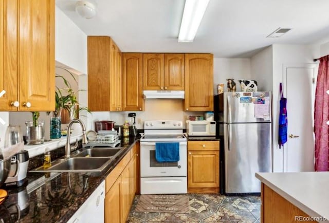 kitchen with white appliances and sink