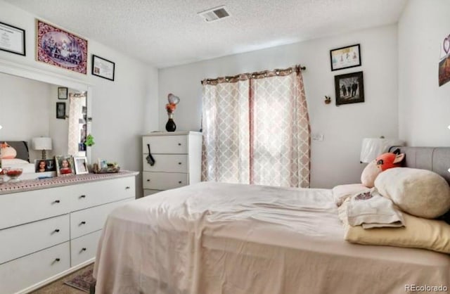 bedroom with a textured ceiling