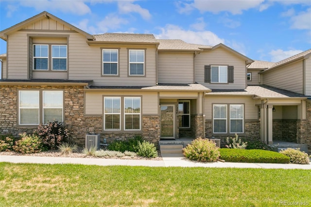1284 Timber Run Hts, Monument, CO 80132 - view of front facade featuring stone siding, a front lawn, and a shingled roof