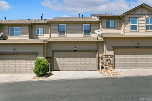 1284 Timber Run Hts, Monument, CO 80132 - multi unit property with an attached garage and stone siding