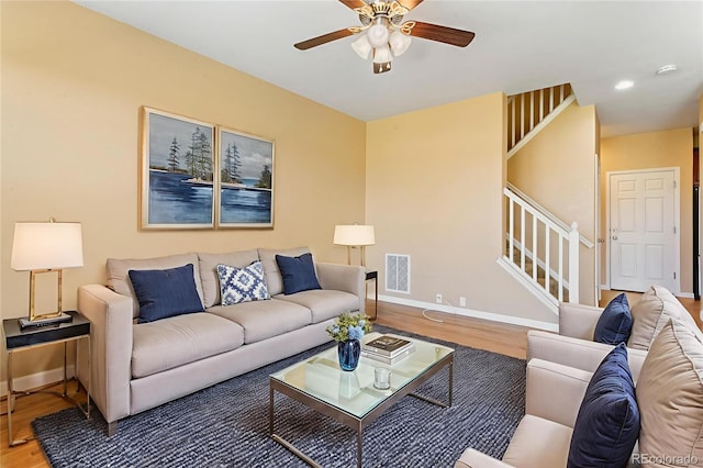1284 Timber Run Hts, Monument, CO 80132 - living room with wood finished floors, stairway, and ceiling fan