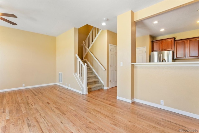 1284 Timber Run Hts, Monument, CO 80132 - unfurnished living room featuring stairway, a ceiling fan, recessed lighting, and light wood-style floors