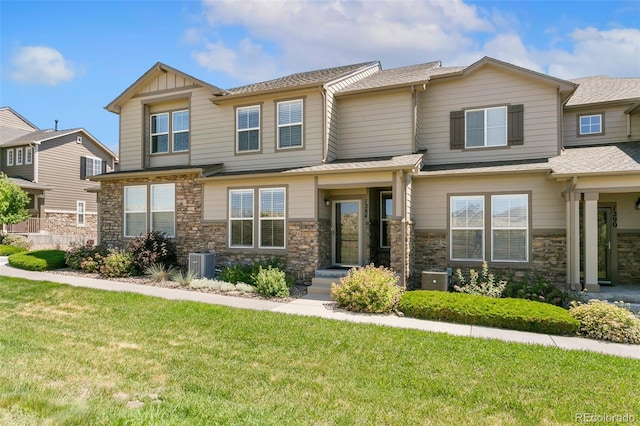 1284 Timber Run Hts, Monument, CO 80132 - view of front of house with a front lawn, stone siding, and a shingled roof