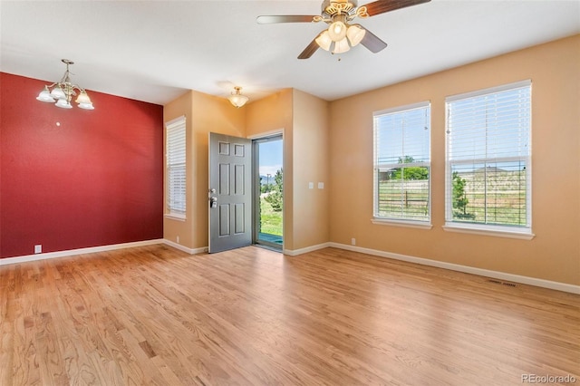1284 Timber Run Hts, Monument, CO 80132 - foyer featuring light wood-style floors, a ceiling fan, and a chandelier