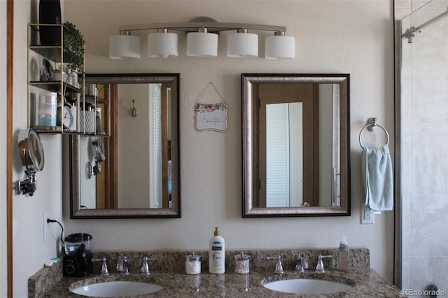 bathroom featuring double vanity and a sink