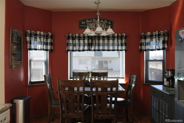 dining space with a chandelier