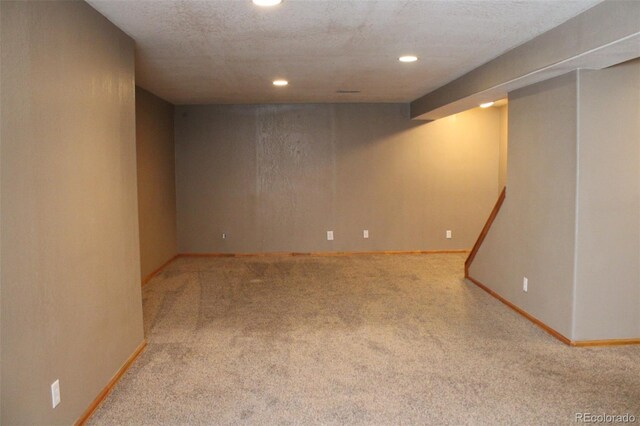 finished basement featuring recessed lighting, carpet, and baseboards