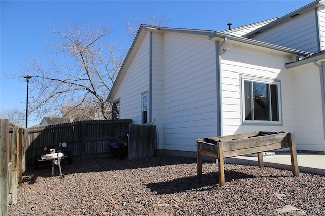 view of side of property with fence