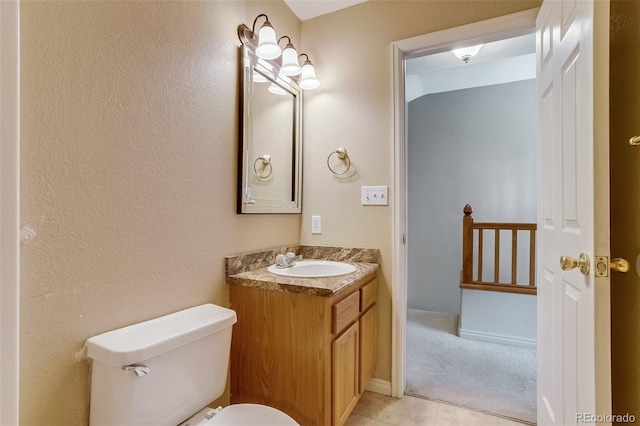 2035 Overland Dr, Brighton, CO 80601 - bathroom with toilet, vanity, and tile patterned flooring