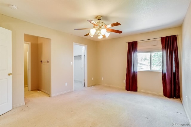 2035 Overland Dr, Brighton, CO 80601 - unfurnished bedroom featuring light colored carpet, a walk in closet, and baseboards