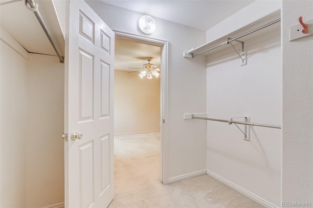 2035 Overland Dr, Brighton, CO 80601 - spacious closet featuring light colored carpet and ceiling fan