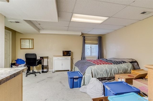 2035 Overland Dr, Brighton, CO 80601 - bedroom featuring light carpet, a paneled ceiling, and an office area