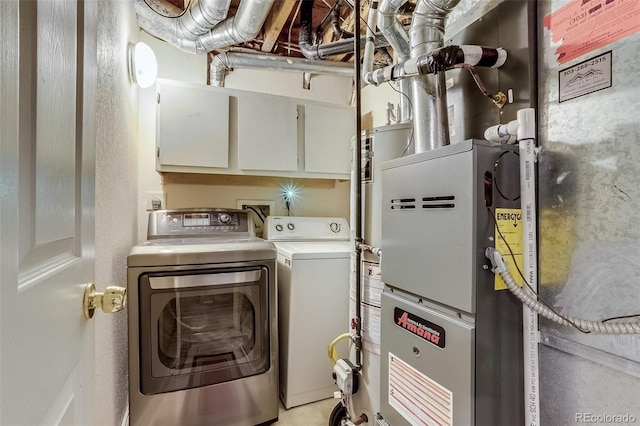 2035 Overland Dr, Brighton, CO 80601 - clothes washing area featuring independent washer and dryer and cabinet space
