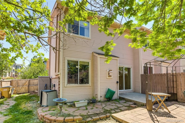 2035 Overland Dr, Brighton, CO 80601 - back of house featuring a patio and a fenced backyard