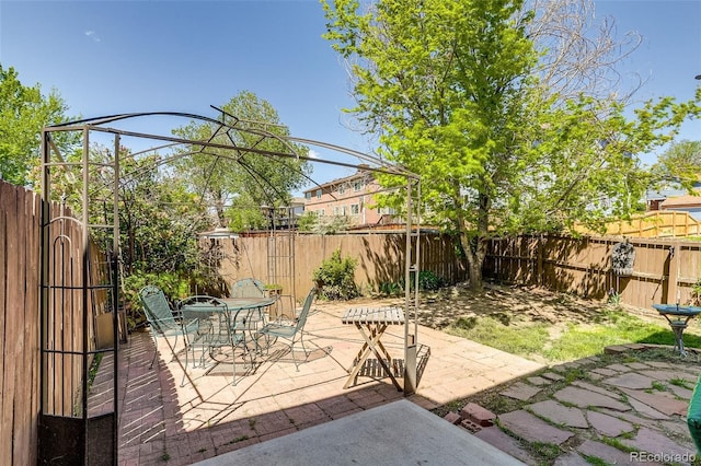 2035 Overland Dr, Brighton, CO 80601 - view of patio / terrace with a fenced backyard and outdoor dining area