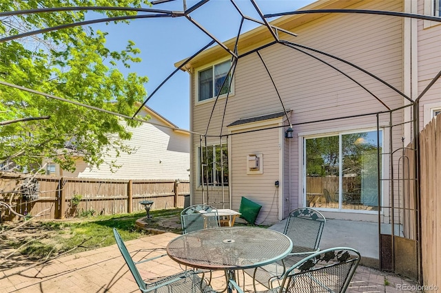 2035 Overland Dr, Brighton, CO 80601 - view of patio featuring fence and outdoor dining area