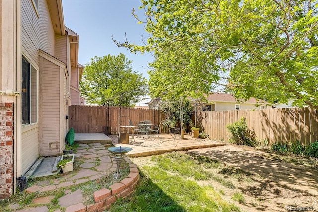2035 Overland Dr, Brighton, CO 80601 - fenced backyard with a patio area