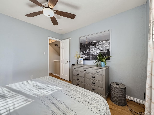 6664 Gray St, Arvada, CO 80003 - bedroom featuring wood finished floors and a ceiling fan