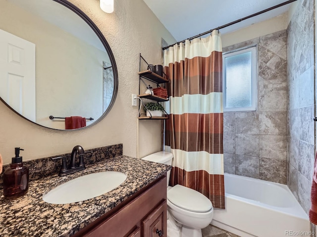 6664 Gray St, Arvada, CO 80003 - full bathroom with vanity, a textured wall, and shower / tub combo