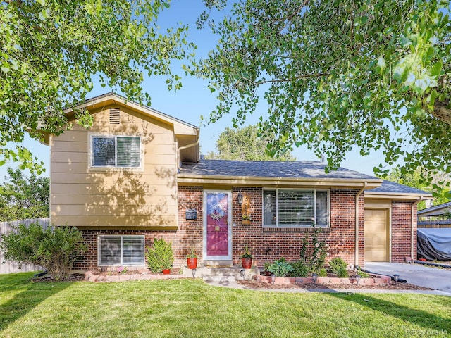 6664 Gray St, Arvada, CO 80003 - tri-level home with brick siding, an attached garage, a front yard, and roof with shingles