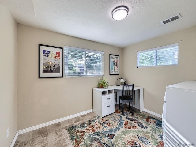6664 Gray St, Arvada, CO 80003 - home office featuring a textured ceiling and washer / dryer