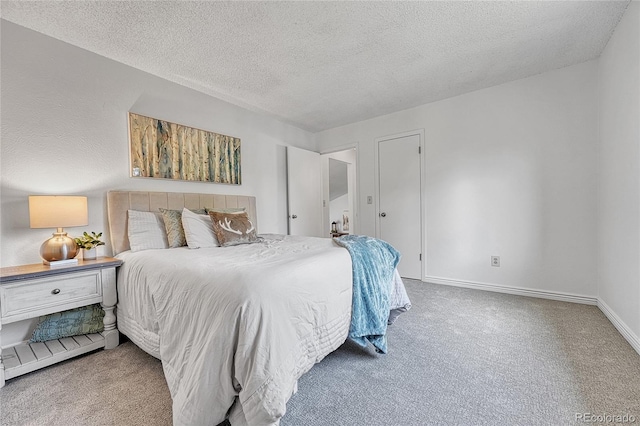 4726 S Taft St, Morrison, CO 80465 - carpeted bedroom with a textured ceiling and baseboards