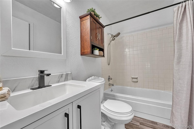 4726 S Taft St, Morrison, CO 80465 - bathroom with wood finished floors, shower / bath combination with curtain, vanity, and a textured wall