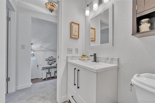 4726 S Taft St, Morrison, CO 80465 - bathroom featuring a textured ceiling, a textured wall, and vanity