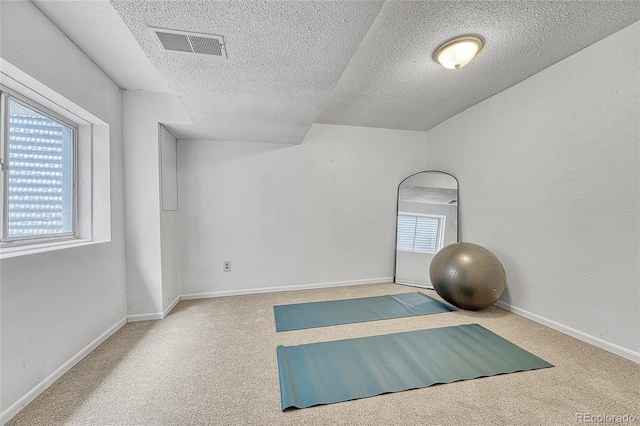 4726 S Taft St, Morrison, CO 80465 - exercise area with carpet and a textured ceiling