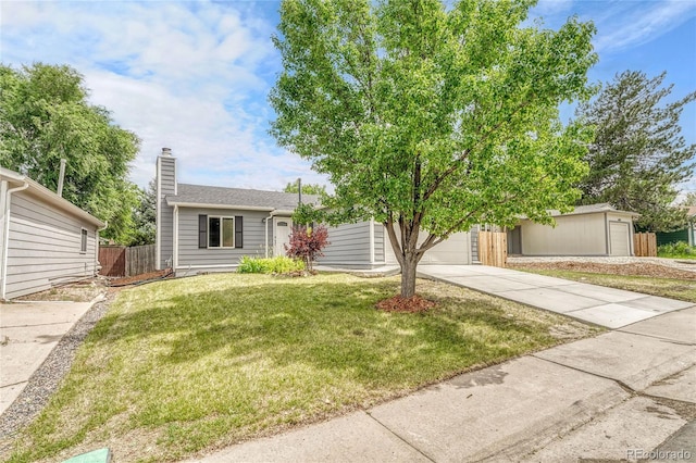 4726 S Taft St, Morrison, CO 80465 - view of front of property featuring concrete driveway, a chimney, and a garage
