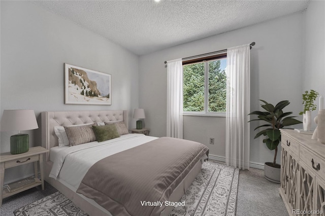 4726 S Taft St, Morrison, CO 80465 - bedroom featuring light carpet and a textured ceiling
