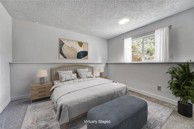4726 S Taft St, Morrison, CO 80465 - carpeted bedroom with a textured ceiling and a textured wall