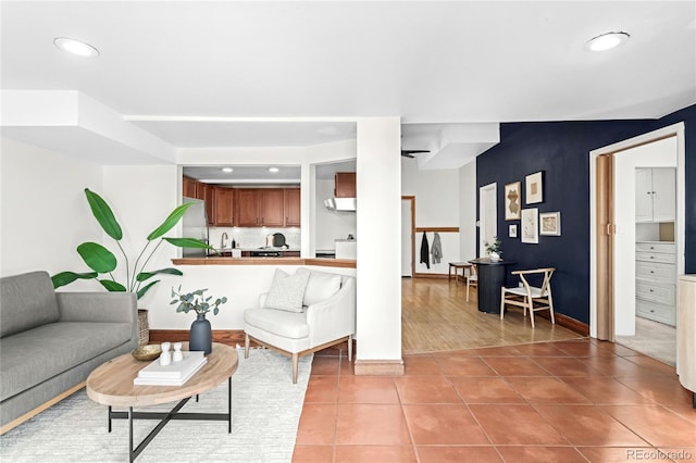 living area featuring light tile patterned floors and recessed lighting