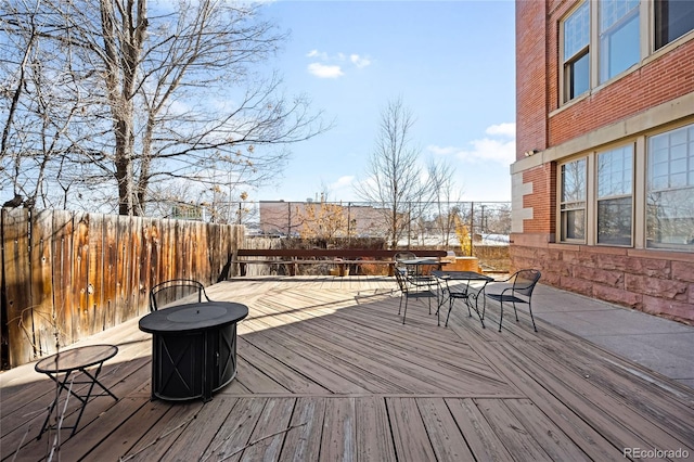 2351 Federal Blvd Unit 102, Denver, CO 80211 - deck with outdoor dining space and a fenced backyard
