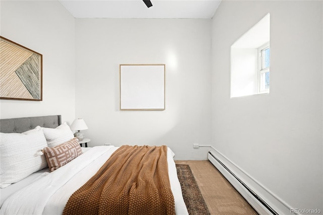 2351 Federal Blvd Unit 102, Denver, CO 80211 - bedroom featuring a baseboard radiator, carpet floors, and ceiling fan