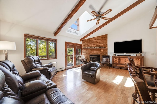 living room with beam ceiling, a fireplace, ceiling fan, baseboard heating, and light wood-style flooring