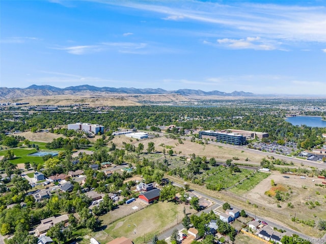 birds eye view of property featuring a water and mountain view