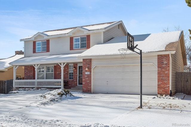 front of property with covered porch and a garage