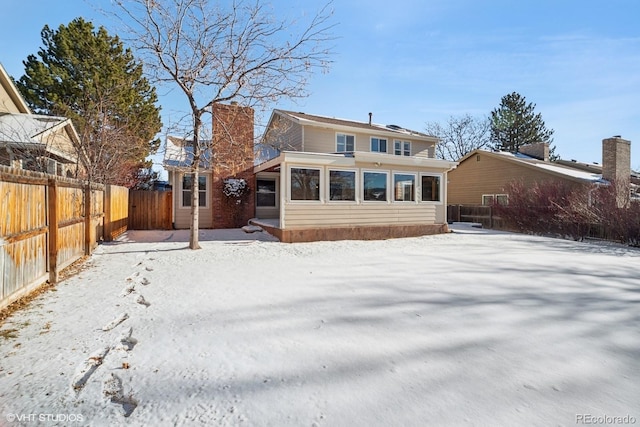 view of snow covered house