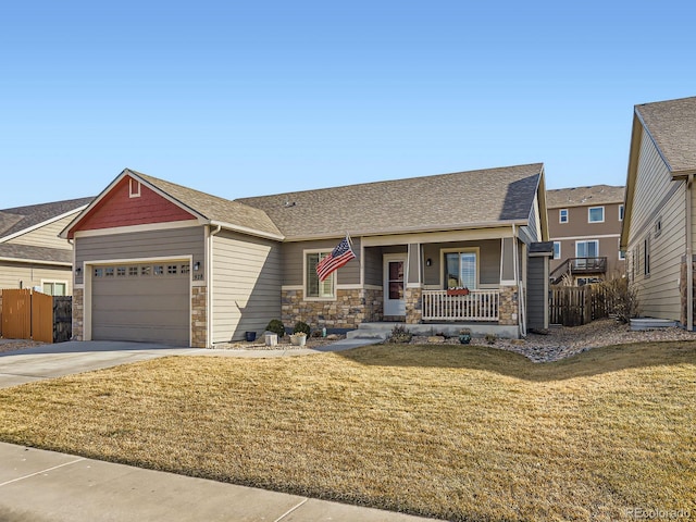 craftsman house featuring covered porch, concrete driveway, a garage, stone siding, and a front lawn