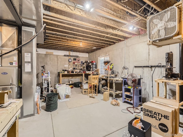 unfinished basement featuring a workshop area