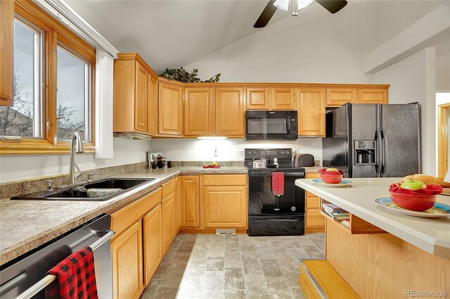 kitchen with lofted ceiling, light countertops, a sink, ceiling fan, and black appliances