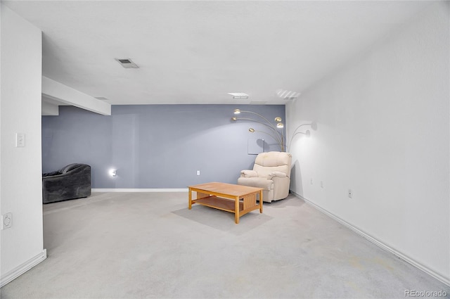 sitting room featuring light carpet, visible vents, and baseboards