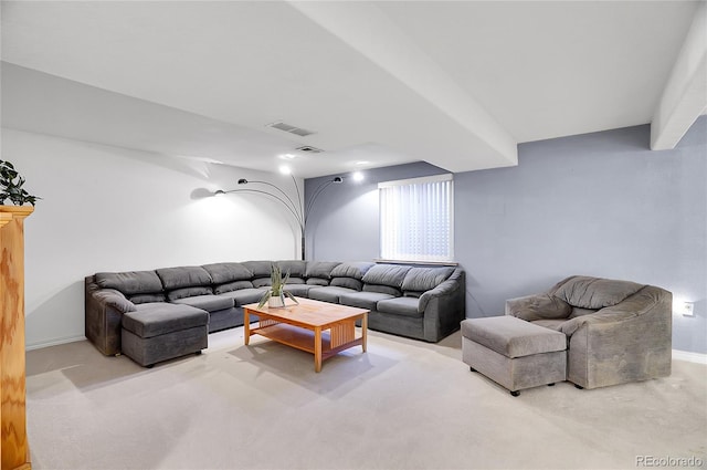 living room with light carpet, visible vents, and baseboards