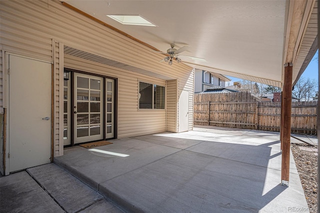 view of patio featuring ceiling fan and fence