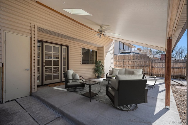 view of patio / terrace with outdoor lounge area, fence, and ceiling fan