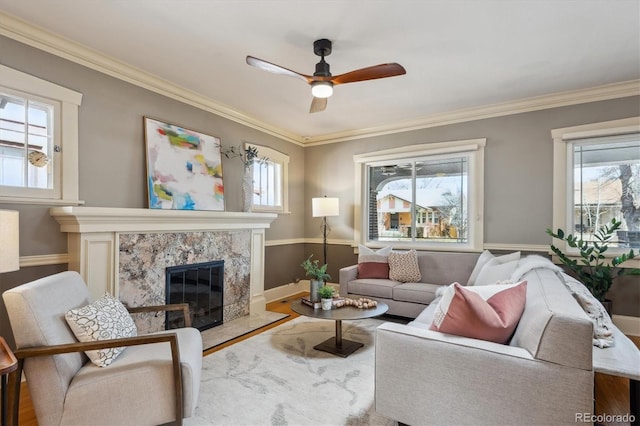 living room featuring ornamental molding and a wealth of natural light