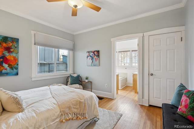 bedroom featuring light wood-type flooring, baseboards, visible vents, and crown molding