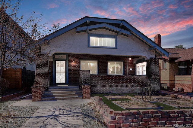 view of front facade featuring brick siding