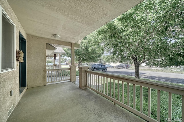 balcony featuring a porch